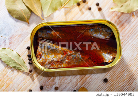 Open tin can of spicy sardines in aluminium can Open tin can of spicy sardines in aluminium can 119044903