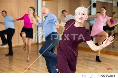 Elderly pair practicing Latino dance in dance studio 119045804