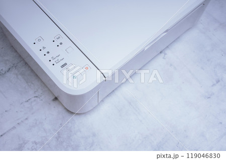 White printer for printing and scanning documents, close-up on a marble table. 119046830