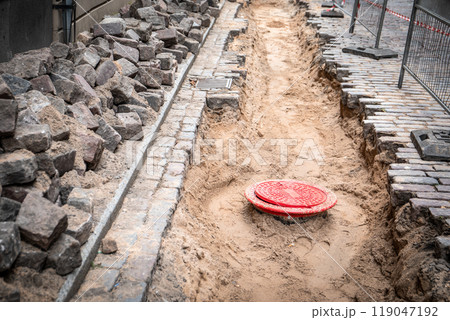 Street repairs in the old town. Replacement of water pipes and paving 119047192