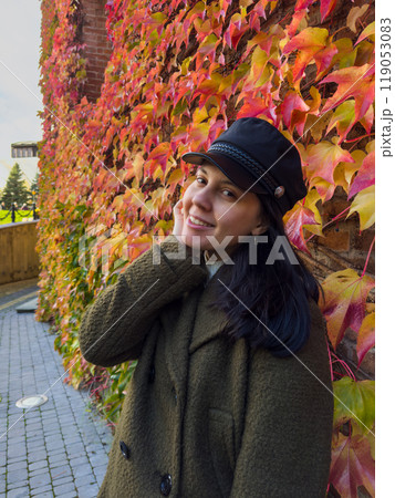 Stylish Woman in Autumn Foliage Stylish Woman in Autumn Foliage 119053083