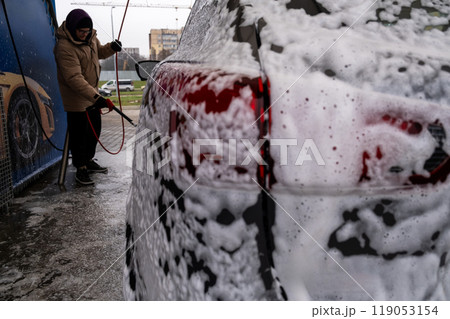 SUV Being Washed at Car Wash 119053154