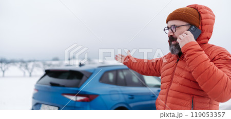 Angry man standing by electric car, battery run out of power before reaching destination. Man phone calling for help waiting for breakdown service car, tow truck. Angry man standing by electric car, battery run out of power before reaching destination. Man phone calling for help waiting for breakdown service car, tow truck. 119053357
