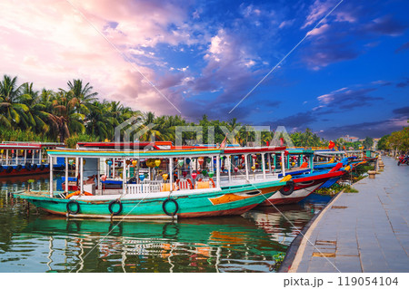 Traditional Vietnamese boats on the Thu bon river in old town in Hoi An in Vietnam Traditional Vietnamese boats on the Thu bon river in old town in Hoi An in Vietnam 119054104