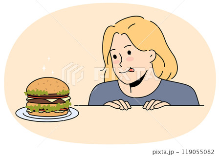 Excited child look at delicious burger on table 119055082