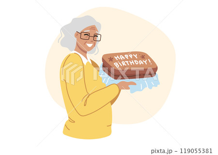 Birthday cake in hands of happy elderly woman celebrating centenary and rejoicing in congratulations 119055381