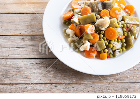 Vegetable stew (menestra de verduras) on wooden table Vegetable stew (menestra de verduras) on wooden table 119059172