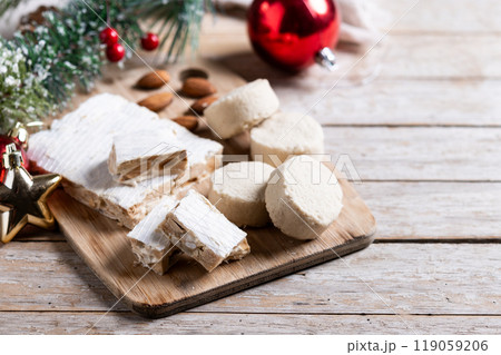 Christmas almond nougat and shortbread on wooden table Christmas almond nougat and shortbread on wooden table 119059206