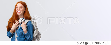 Education, student life and happiness concept. Cheerful good-looking redhead caucasian girl, college student with backpack and headphones over neck laughing smiling at camera 119060452