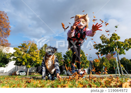 Cute young little kid girl wear cat furry mask enjoy have fun playing outdoors in forest street park. Children therian wild animal character trendy fan culture. Teenager social expression hobby Cute young little kid girl wear cat furry mask enjoy have fun playing outdoors in forest street park. Children therian wild animal character trendy fan culture. Teenager social expression hobby 119064972