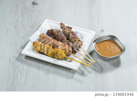 Skewers of pork and beef with satay sauce Skewers of pork and beef with satay sauce 119065348