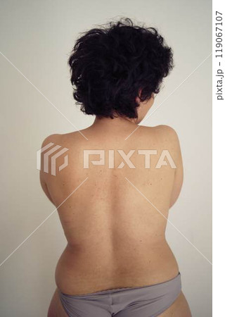young plus size woman topless in panties from the back young plus size woman topless in panties from the back 119067107