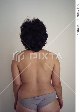 young plus size woman topless in panties from the back young plus size woman topless in panties from the back 119067109