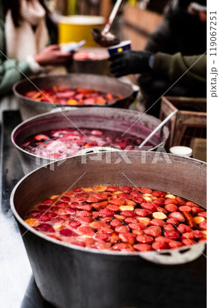 Hot mulled wine on a street food market Hot mulled wine on a street food market 119067251