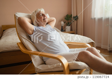 Calm senior woman relaxing on soft comfortable chair having daytime nap, carefree middle aged female breathing fresh air enjoying no stress free peaceful weekend resting Calm senior woman relaxing on soft comfortable chair having daytime nap, carefree middle aged female breathing fresh air enjoying no stress free peaceful weekend resting 119067724