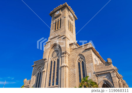 Clock Tower on Nha Trang Cathedral or Stone Church or Christ the King Cathedral in Vietnam on background blue sky 119068311