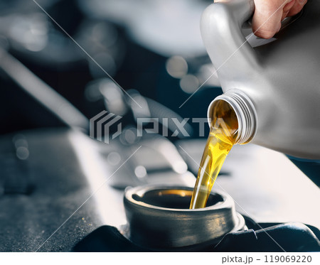 Pouring engine oil into your car is vital for proper maintenance and optimal performance 119069220
