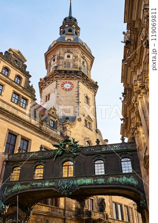 Ornate bridge with carvings and statues connects two buildings in Dresden Castle complex. Historical architecture in Germany Ornate bridge with carvings and statues connects two buildings in Dresden Castle complex. Historical architecture in Germany 119069811