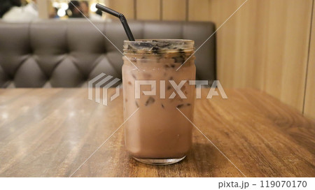 Ice milk cincau is a traditional cold beverage from Indonesia or iced grass jelly with milk and brown sugar. Ice milk cincau is a traditional cold beverage from Indonesia or iced grass jelly with milk and brown sugar. 119070170