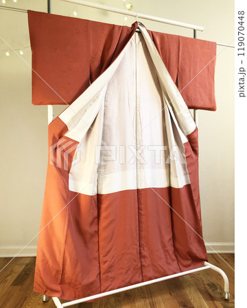 Colorful kimono robe on a hanger, promo photo for an online women's clothing store Colorful kimono robe on a hanger, promo photo for an online women's clothing store 119070448