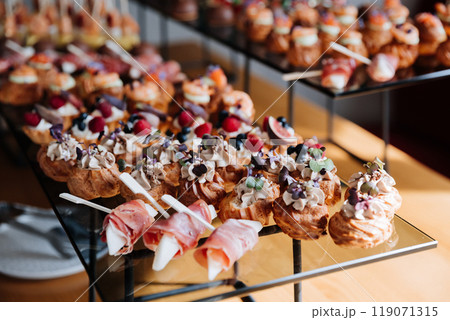 Assorted gourmet appetizers and desserts on display, luxury events, catering, and celebrations Assorted gourmet appetizers and desserts on display, luxury events, catering, and celebrations 119071315