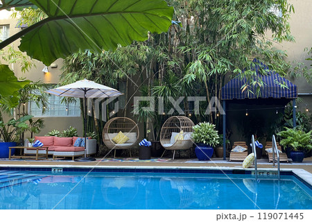 Garden furniture near the pool, patio interior Garden furniture near the pool, patio interior 119071445