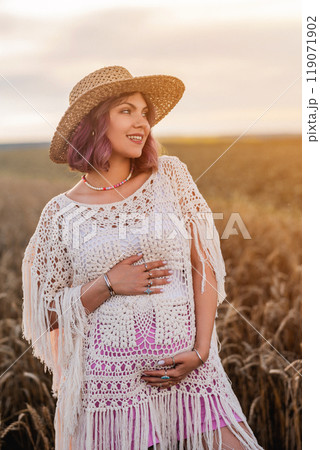 Beautiful Hippie Pregnant Woman With Baby Bump Belly On Nature Background. Pink Beautiful Hippie Pregnant Woman With Baby Bump Belly On Nature Background. Pink 119071902