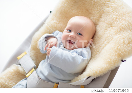 Adorable baby on sheepskin blanket Adorable baby on sheepskin blanket 119071966