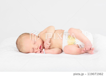Newborn baby boy in hospital cot Newborn baby boy in hospital cot 119071982