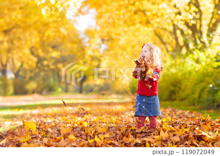Kids playing in autumn park 119072049