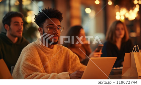Friends Gather in Cozy Cafe Working and Socializing on a Fall Evening 119072744