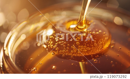 Artistic CloseUp of Honey Jar with Lid Removed, Perfect for Kitchen Decor and Culinary Publications Artistic CloseUp of Honey Jar with Lid Removed, Perfect for Kitchen Decor and Culinary Publications 119073292