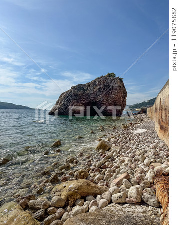 Large rock in the sea at sunny day 119075882