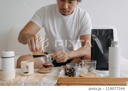 Step by step of man making espresso with hand press tools. 119077164