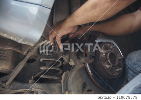 Close up Man hands fixing Car machinery vehicle mechanical service. Mechanic man hands repairing car auto repair shop. open vehicle hood checking up auto mobile. Vehicle Car maintenance engineer. Close up Man hands fixing Car machinery vehicle mechanical service. Mechanic man hands repairing car auto repair shop. open vehicle hood checking up auto mobile. Vehicle Car maintenance engineer. 119078579