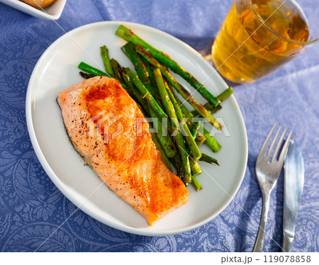 Sliced tasty salmon with asparagus 119078858