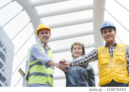 Group of multiracial people Teamwork meeting join hands Engineer Manager Foreman fist bump together. Close up diversity engineer people hands partner teams. Business connection team join partnership 119079450