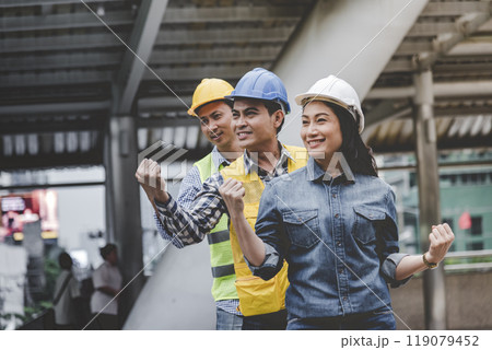 Group of multiracial people Teamwork meeting join hands Engineer Manager Foreman fist bump together. Close up diversity engineer people hands partner teams. Business connection team join partnership 119079452