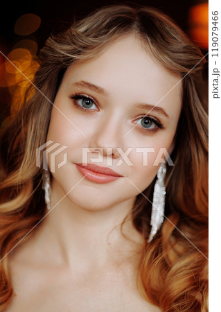Portrait of a woman with evening make-up with long blonde hair. 119079466