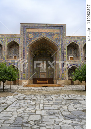 Courtyard of the Ulugbek Madrasah of 14 century in Samarkand, Uzbekistan with decorated portal 119082897
