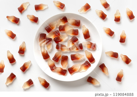 Gummy jellies in shape of soda bottles on white background. Gummy jellies in shape of soda bottles on white background. 119084888