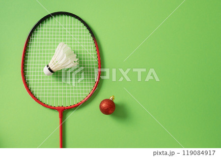 White badminton shuttlecocks and two badminton rackets. Concept racket sport. White badminton shuttlecocks and two badminton rackets. Concept racket sport. 119084917