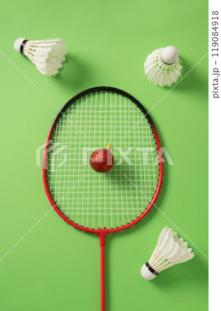 Christmas concept. badminton racket and white feather shuttlecock. Xmas greeting card. Christmas concept. badminton racket and white feather shuttlecock. Xmas greeting card. 119084918