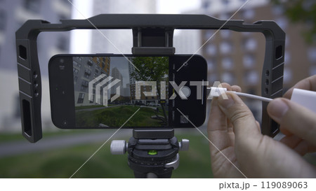 Professional shooting on phone with memory card. Action. External disk for recording material from phone. Shooting on phone with stabilizer and external memory Professional shooting on phone with memory card. Action. External disk for recording material from phone. Shooting on phone with stabilizer and external memory 119089063