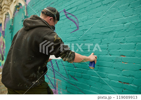 Creating new graffiti artwork outdoors Creating new graffiti artwork outdoors 119089913