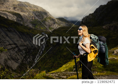 Embarking on a Solo Adventure in Nature Enjoying a Hike Through Majestic Lofoten Mountains 119092471