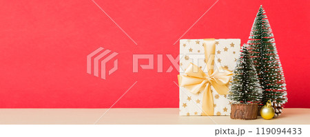Christmas composition. craft Gift box, small tree, branches and craft DIY decorations on white background. New year concept. Christmas home decoration Flat lay, top view, copy space 119094433