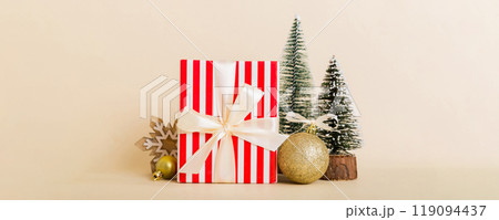 Christmas composition. craft Gift box, small tree, branches and craft DIY decorations on white background. New year concept. Christmas home decoration Flat lay, top view, copy space 119094437