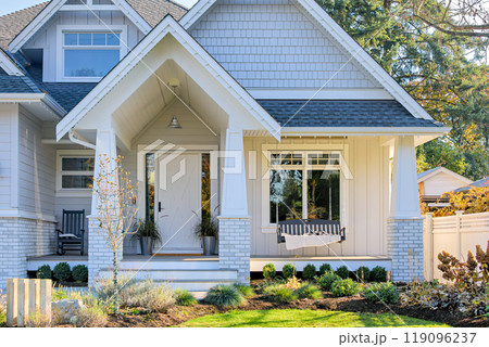 Residential house with open patio under the porch on sunny autumn day Residential house with open patio under the porch on sunny autumn day 119096237