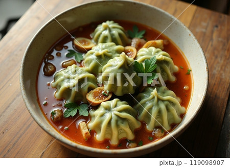dumplings with meat from dough with spinach 119098907
